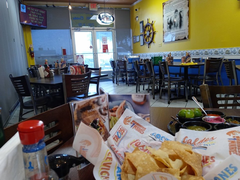 Dining room tables in a family-friendly seafood spot.